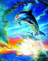 Стая дельфинов на волне